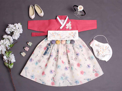 Floral themed baby girl hanbok in white and plum red. This baby girl hanbok comes with 5 accessories and has flowers designed on the dress for a beautiful look.