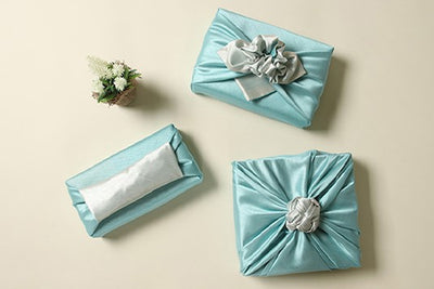 Light teal blue and slate Korean fabric wrapping look amazing together and provide a traditional and beautiful present to any boy or girl.