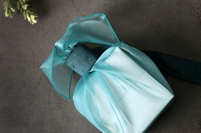 Best suited for boys or men, this aquamarine lucid Bojagi makes the perfect fabric wrapping paper for birthdays and many other Korean traditions.