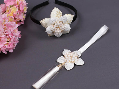The Floral Star Tassel Norigae is a whimsical accessory for your hanbok and it comes in ivory.