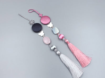 A Moon and Butterfly Pendant-Tassel Norigae in aquamarine or rose is perfect to dress up your outfit and bring you good fortune.