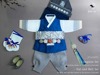 norigae with blue baby boy hanbok that complements the overall look