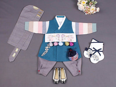 This is a heavenly blue baby hanbok for boys in the color sapphire blue. Many Korean parents like this style because of the radiant blue of the vest with the multi-colored sleeves of the Saekdong Jeogori. 