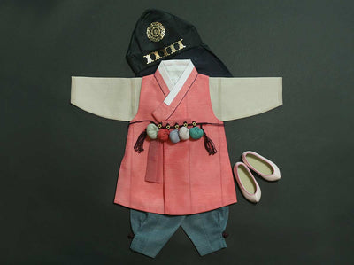Strong Baby Boy Hanbok in Bold Orange with Dol Accessories for Doljanchi. The string belt with dol balls and white dol hanbok shoes are included to provide our suggested dol accessories for this specific set.