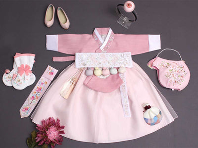 Yuna baby girl hanbok in pink with hanbok accessories to complete this hanbok. All the hanbok accessories are primarily used for Doljanchi.