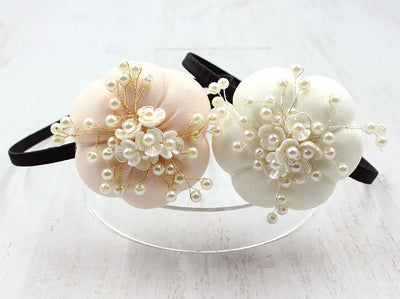 A pumpkin floral pearl hairband is stunning on any baby girl and she will feel even more loved when everyone gushes about how angelic she looks wearing it.
