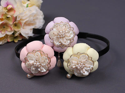 The mother of pearl hairband in white, pink, and purple bring subtle class to any Korean event.