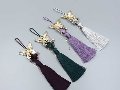 Accessorize your hanbok with this Gold Butterfly Trace Tassel Norigae. It comes in four colors including plum, sage, black, and slate.
