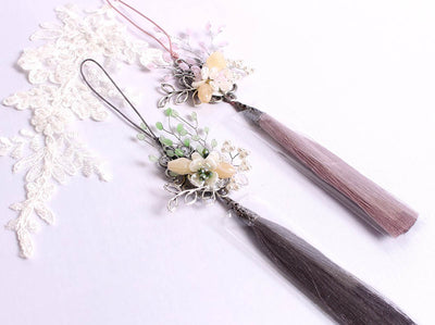 A Flower Garden Tassel in either gray or salmon is a wonderful addition to your wardrobe.