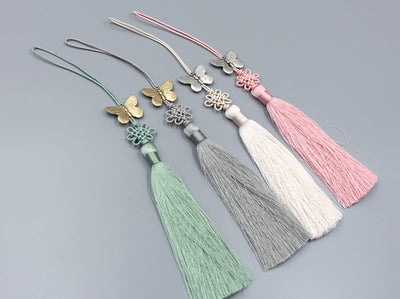 Gold & Silver Butterfly Tassel Norigae in sage, ivory, salmon, and slate will provide you luck and also add elegance to your outfit.